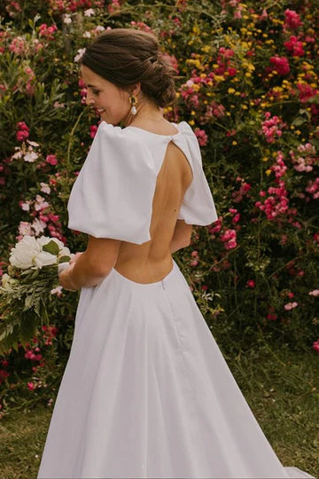 Vestido de novia largo con escote en V profundo y mangas abullonadas con espalda abierta